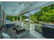 Outdoor porch with a sectional sofa, grill, and a view of the pool and backyard at 619 Thomas Glenn Ct, Charleston, SC 29412