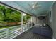 Outdoor porch with a sectional sofa, grill, television, and a view of the backyard at 619 Thomas Glenn Ct, Charleston, SC 29412