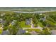 Aerial shot of a charming home with a lush green lawn and stunning marsh views in the distance at 637 Lynne Ave, Charleston, SC 29412