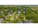 Aerial view of a home surrounded by mature trees with a water view offering privacy and scenic beauty at 637 Lynne Ave, Charleston, SC 29412
