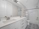 Bright bathroom with a double vanity, tub/shower combo, and patterned tile flooring at 637 Lynne Ave, Charleston, SC 29412