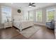 Bright bedroom with large windows, wooden floors, and a seating area at 637 Lynne Ave, Charleston, SC 29412