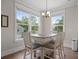 Cozy dining area with bright natural light, table for four, and nice flooring at 637 Lynne Ave, Charleston, SC 29412