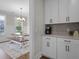 Dining area featuring a table and bench seating, bathed in natural light, next to the kitchen at 637 Lynne Ave, Charleston, SC 29412