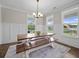 Bright dining room with large windows and modern lighting at 637 Lynne Ave, Charleston, SC 29412