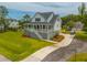 Charming two-story home with lush yard, featuring a covered porch and ample parking at 637 Lynne Ave, Charleston, SC 29412