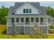 Charming two-story home with a inviting front porch and well-manicured landscaping at 637 Lynne Ave, Charleston, SC 29412