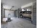 Spacious garage with two garage doors and a car parked, providing ample parking and storage at 637 Lynne Ave, Charleston, SC 29412