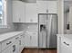 Modern kitchen boasts stainless steel appliances, including a refrigerator with a water dispenser, and white cabinetry at 637 Lynne Ave, Charleston, SC 29412