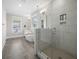 Spacious main bathroom featuring a glass-enclosed shower and soaking tub at 637 Lynne Ave, Charleston, SC 29412
