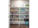 Walk-in pantry with floor-to-ceiling white shelving and ample storage space at 637 Lynne Ave, Charleston, SC 29412