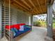 Relaxing outdoor patio with a hanging swing bed, perfect for enjoying the serene surroundings at 637 Lynne Ave, Charleston, SC 29412