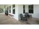 Inviting outdoor seating on a covered porch with wooden floors and white railings at 637 Lynne Ave, Charleston, SC 29412