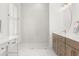 Modern bathroom with a glass enclosed shower, marble floors, and custom vanity at 703 Blueway Ave, Summerville, SC 29486