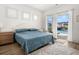 Cozy bedroom with a comfortable bed and access to a private outdoor pool at 703 Blueway Ave, Summerville, SC 29486