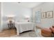 Charming bedroom with a white quilt, shuttered window and neutral décor at 703 Blueway Ave, Summerville, SC 29486