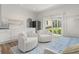 Bright bonus room with plenty of natural light, comfortable seating, and access to the backyard at 703 Blueway Ave, Summerville, SC 29486