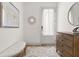 Inviting entryway boasts neutral decor, light wood floors, and a statement rug at 703 Blueway Ave, Summerville, SC 29486