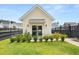 Charming exterior view of separate structure with well-manicured lawn and attractive landscaping at 703 Blueway Ave, Summerville, SC 29486