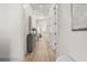 Bright hallway with beautiful flooring and gray accent cabinet with decor, connecting to the rest of the home at 703 Blueway Ave, Summerville, SC 29486
