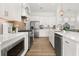 Modern kitchen boasting stainless steel appliances, white cabinetry, tile backsplash, and an open layout at 703 Blueway Ave, Summerville, SC 29486