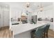 Bright, open kitchen featuring a quartz countertop island, stainless steel appliances, and pendant lighting at 703 Blueway Ave, Summerville, SC 29486