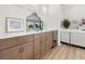 Bright living room features custom cabinets, countertops, and a beverage fridge at 703 Blueway Ave, Summerville, SC 29486