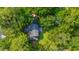 A high-angle aerial view of the home surrounded by dense trees at 802 Robert E. Lee Blvd, Charleston, SC 29412