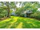 Expansive backyard featuring a well-maintained lawn and detached garage at 802 Robert E. Lee Blvd, Charleston, SC 29412