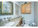 Stylish bathroom with granite countertops, modern sink, and elegant mirror and cabinet at 802 Robert E. Lee Blvd, Charleston, SC 29412