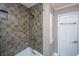 Updated bathroom with modern showerhead and tile surround at 802 Robert E. Lee Blvd, Charleston, SC 29412