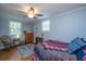 Comfortable bedroom featuring hardwood floors and a ceiling fan with overhead lighting at 802 Robert E. Lee Blvd, Charleston, SC 29412