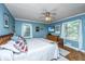 Serene bedroom with natural light, ceiling fan, and neutral decor for relaxation and comfort at 802 Robert E. Lee Blvd, Charleston, SC 29412