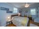Cozy bedroom featuring hardwood floors, ample natural light, and a ceiling fan at 802 Robert E. Lee Blvd, Charleston, SC 29412