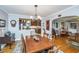 Inviting dining room with hardwood floors, stylish lighting, and an open view to the modern kitchen at 802 Robert E. Lee Blvd, Charleston, SC 29412