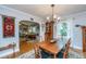 Elegant dining room with wood table, chandelier, and view into the living room at 802 Robert E. Lee Blvd, Charleston, SC 29412