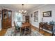 Inviting dining room with a chandelier, hardwood floors, and a built-in china cabinet at 802 Robert E. Lee Blvd, Charleston, SC 29412