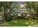Charming brick home nestled amongst mature trees, offering privacy and curb appeal at 802 Robert E. Lee Blvd, Charleston, SC 29412