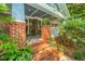 Charming brick front porch with decorative plants and stylish railing at 802 Robert E. Lee Blvd, Charleston, SC 29412