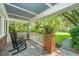 Inviting front porch with rocking chairs and classic brick accents at 802 Robert E. Lee Blvd, Charleston, SC 29412