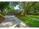 Inviting two-story home with lush front yard and mature trees at 802 Robert E. Lee Blvd, Charleston, SC 29412