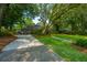 Inviting two-story home with lush front yard and mature trees at 802 Robert E. Lee Blvd, Charleston, SC 29412