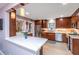 Updated kitchen featuring stainless steel appliances, custom cabinetry, and stone countertops at 802 Robert E. Lee Blvd, Charleston, SC 29412