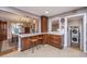 Eat-in kitchen featuring a breakfast bar with seating, modern appliances, and easy access to the laundry room at 802 Robert E. Lee Blvd, Charleston, SC 29412
