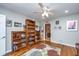 Living room with hardwood floors, built-in bookshelves, and a view to the dining area at 802 Robert E. Lee Blvd, Charleston, SC 29412