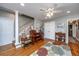 Cozy living room with hardwood floors, a decorative rug, and a piano, creating a warm atmosphere at 802 Robert E. Lee Blvd, Charleston, SC 29412