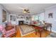 Bright living room featuring a fireplace, built-in shelving, and hardwood floors at 802 Robert E. Lee Blvd, Charleston, SC 29412