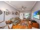 Living room featuring hardwood floors, a cozy seating area, and a television for entertainment at 802 Robert E. Lee Blvd, Charleston, SC 29412