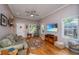 Comfortable living room with a large window, hardwood floors, and modern entertainment setup at 802 Robert E. Lee Blvd, Charleston, SC 29412