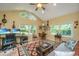 Open living room boasts large windows, vaulted ceilings, and stylish decor. Ideal for relaxing and entertaining at 802 Robert E. Lee Blvd, Charleston, SC 29412